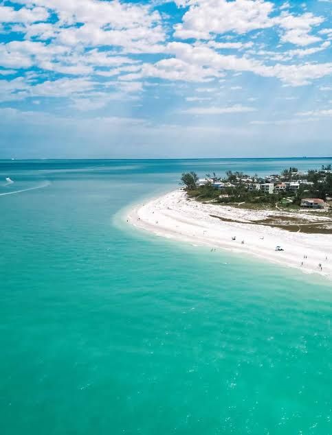 Anna Maria Island beach and turquoise Gulf water, tiki boat tour pickup location